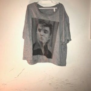 An Elvis Presely shirt 100% percent cotton